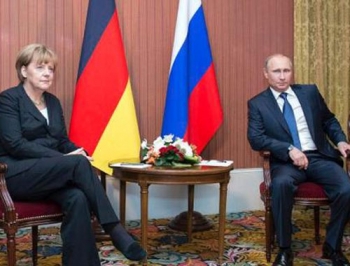 Меркель и Путин целый час говорили об Украине за закрытыми дверями фото