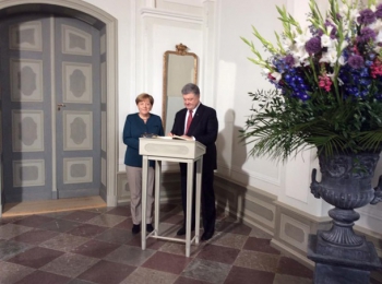 Порошенко и Меркель обсуждали, как заставить РФ выполнять минские договоренности фото