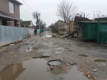 Жителям тихого центра ремонта дороги еще минимум год не видать фото